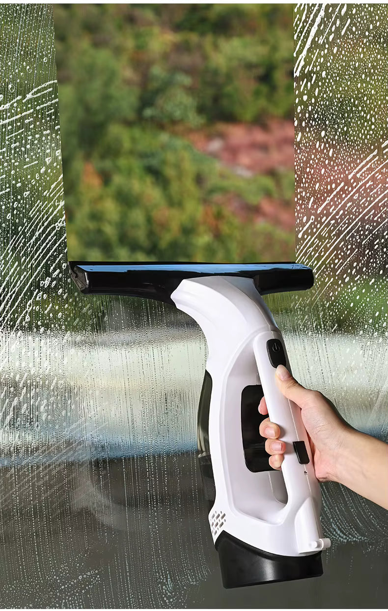 Hand using the ThiccFitts Multifunctional Electric Cordless Window Cleaner Machine to wipe soap and achieve a streak-free clean on a window.