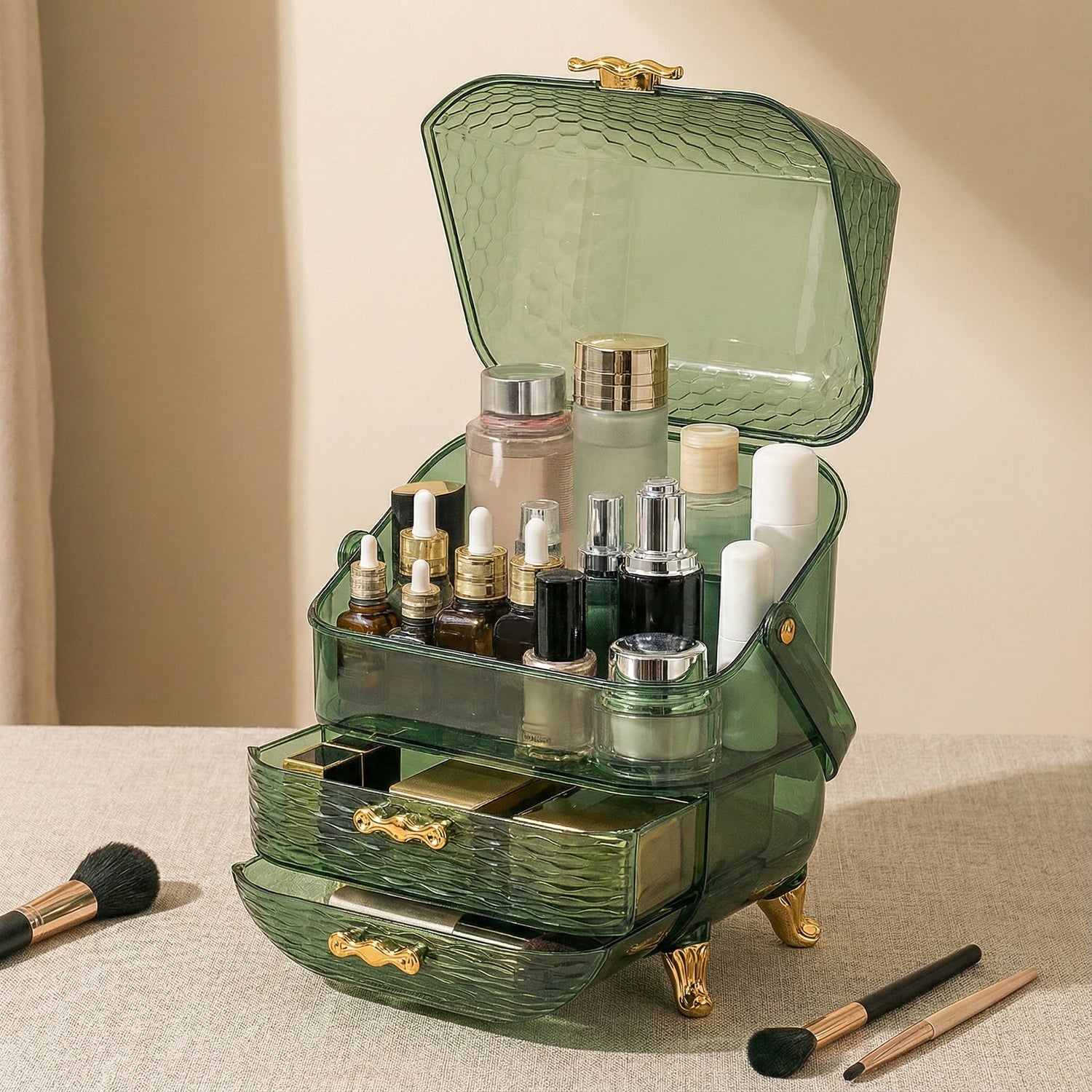 A green, vintage-style makeup organizer with multiple compartments and drawers, filled with skincare bottles, makeup products, and brushes displayed on a beige surface.